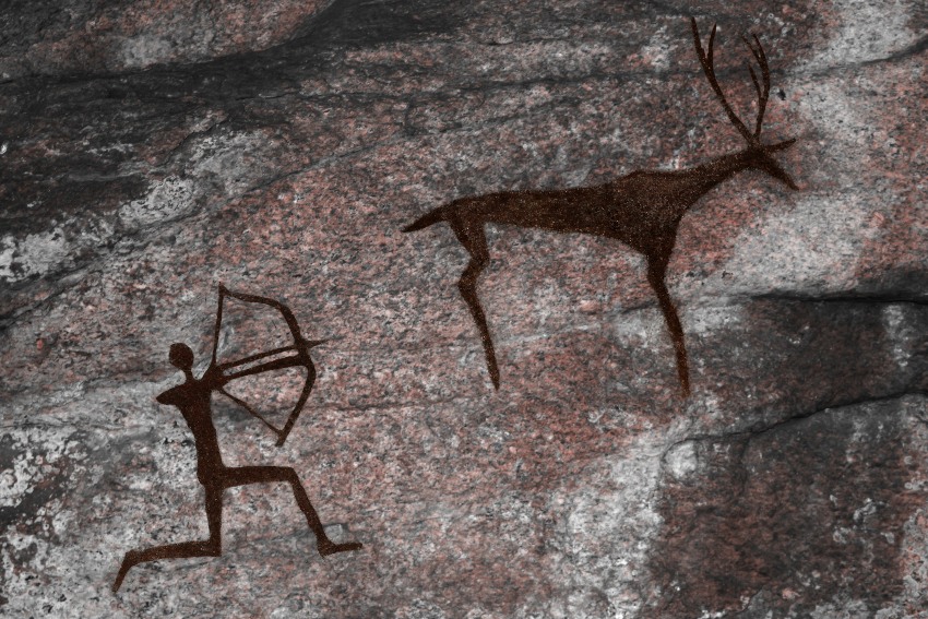 Höhlenmalerei mit Jäger und Hirsch